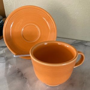 Tangerine Fiesta tea cup and saucer